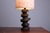 Curious sculptural table lamp in brutalist style. Quite large 84 cm height. The base is made of either ceramic or...