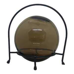 Early 21st Century Decorative Hand Blown Amber Glass Gazing Ball on Black Metal Stand