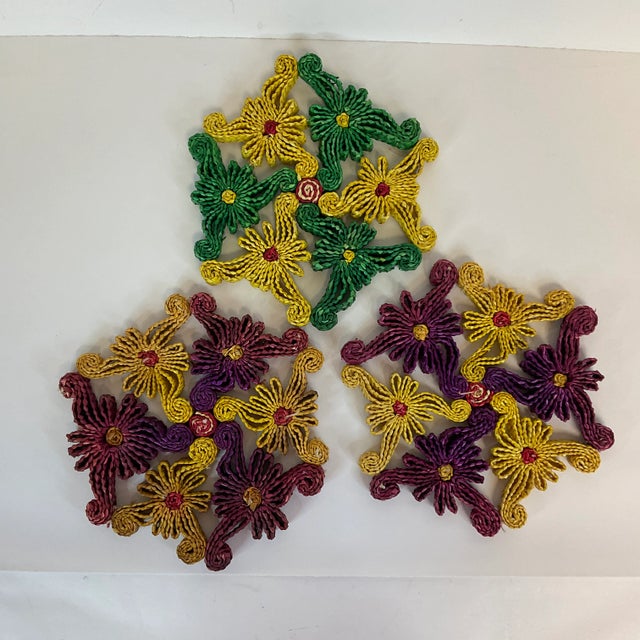 Beautifully colorful, these vintage raffia weave trivets are always great for serving hot dishes. They are all similar...