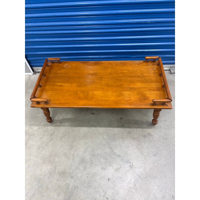 Summary of the Coffee Table:Style & Era: 20th-century Vintage Colonial / Early American reproduction.Likely Brands: Temple...