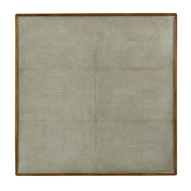 A square top is overlaid with faux shagreen resting above bracket aprons and squared corner legs over a low shagreen...