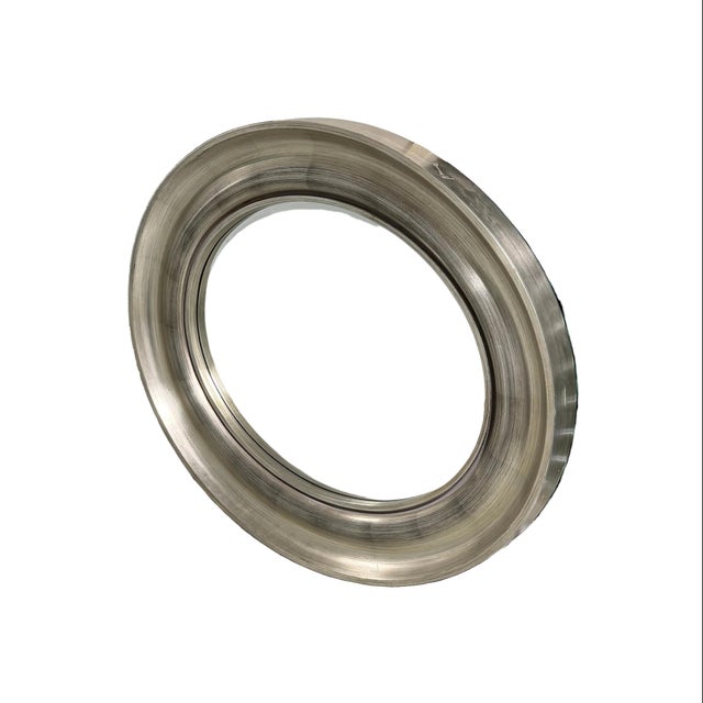 Wonderful Howard Elliott Collection silver leaf wall hanging mirror. Oval shaped with thick frame. Silver leaf is visible,...