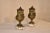 Pair of 19th century mantle urns from France. The pair are lidded, and are wonderfully cast with garlands, reeded design...
