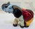 Bring a pop of color and Mexican folk art charm to your decor with this handcrafted ceramic elephant figurine signed...