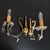 An extraordinary pair of antique sconces. Italy, XX century. Sconces are made of brass - beautiful artistic forging....