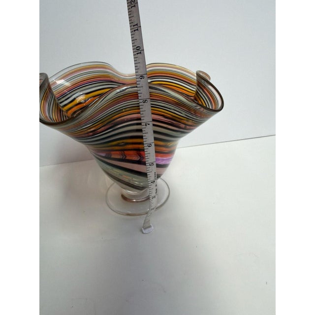 Jozefina Hand-Blown 10-inch Havana Wave Art Glass Vase. Featuring a vibrant rainbow cane swirl design with a unique wavy...