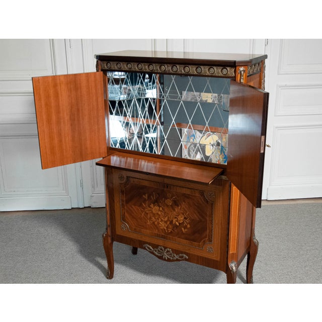 This exquisite 1940s Dry Bar is a remarkable example of Swedish Grace design, masterfully crafted from a luxurious blend...