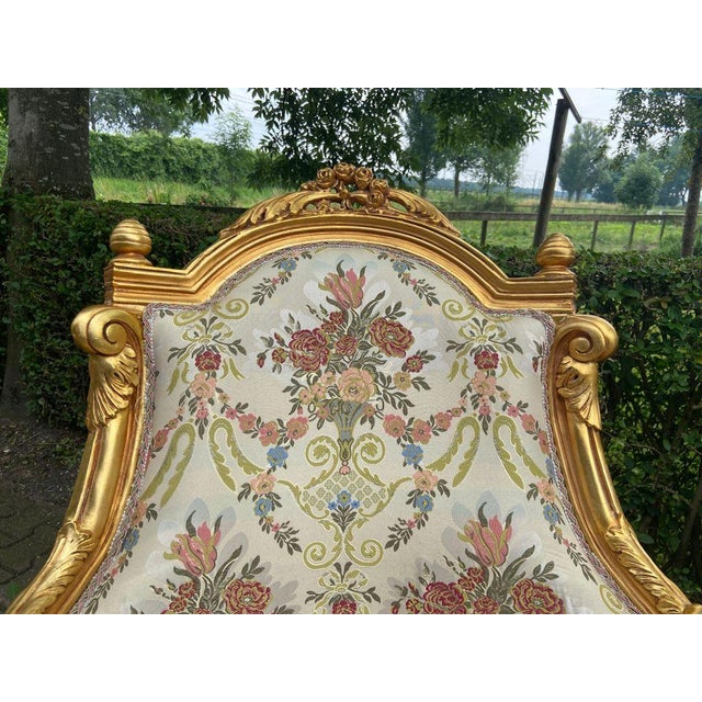 This elegant matching pair of late 20th-century French Louis XVI–style Bergère chairs combines classical neoclassical...