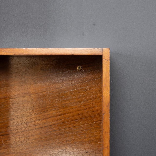 A 20th century collection of english walnut modular shelving by unix, manufactured by phoenix gallery in london during the...