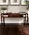 An elegant Edward Wormley for Dunbar walnut console table showcasing the clean, understated lines that made Wormley one of...