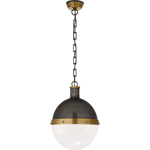 Hicks Large Pendant in Bronze and Hand-Rubbed Antique Brass with White Glass Designer: Thomas O'Brien Canopy: 4.75" Round...