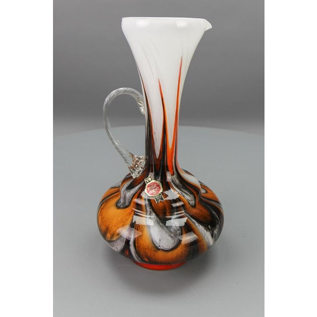 Italian Opaline Florence glass vase in white, brown, orange, and red by Vetreria Barbieri, circa the 1970s. A beautiful...