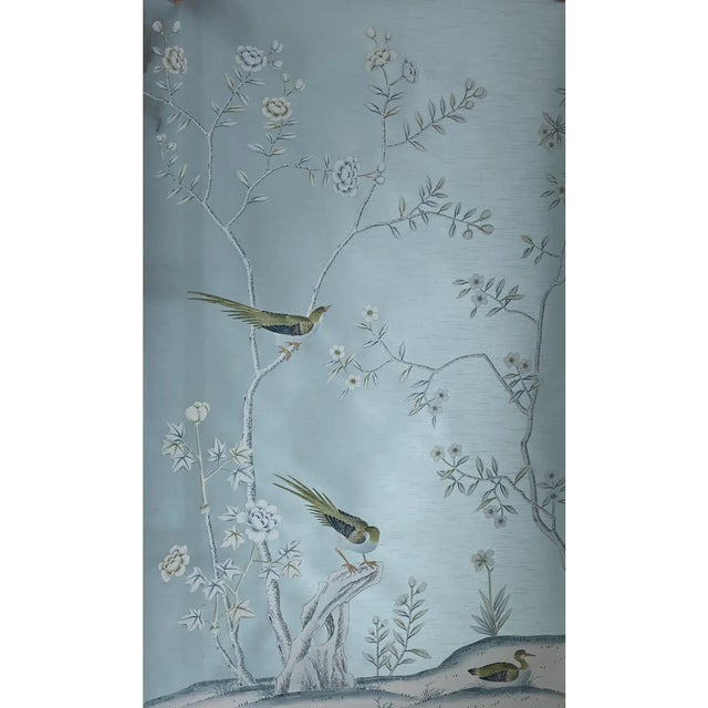 Graceful peacocks and delicate garden birds move quietly among flowering branches in this elegant set of two hand-painted...