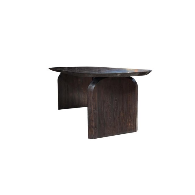 Crafted from solid reclaimed teak wood, this dining table showcases the natural beauty and depth of aged timber. Its...