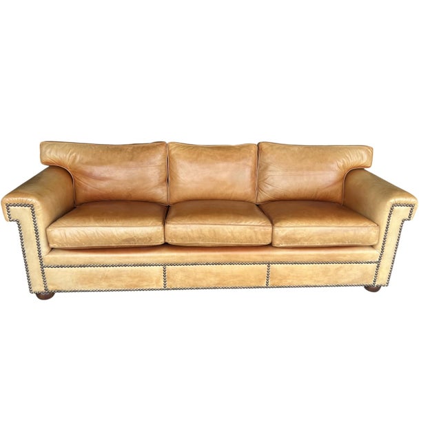 This elegant vintage English-style leather sofa showcases timeless traditional design paired with exceptional comfort and...