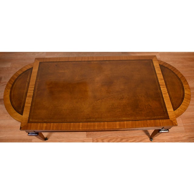 We are pleased to offer this beautiful English Regency Coffee Table, from the 1930s. This table is made of Mahogany wood,...