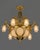 An impressive 1980 French Louis XVI-style chandelier, beautifully crafted in gilded bronze and decorated with sparkling...