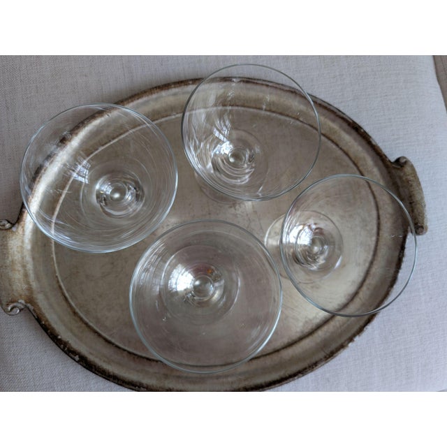 A set of four, clear glass short-stemmed dessert dishes with a generous 12-fluid-ounce bowl. The coupes measure 4.75...