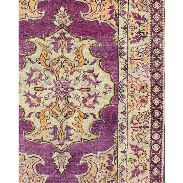 Purple Vintage Turkish Oushak Rug with a Traditional Medallion Design Measures: 3'6'' x 5'8''. This lovely vintage Oushak...