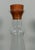 This Danish Modern decanter by Dansk International Designs features a sculptural clear glass body topped with a hand-...