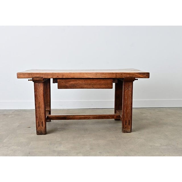 A 19th century French farmhouse table, whose robust design is a practical solution for the modern kitchen to pivot between...