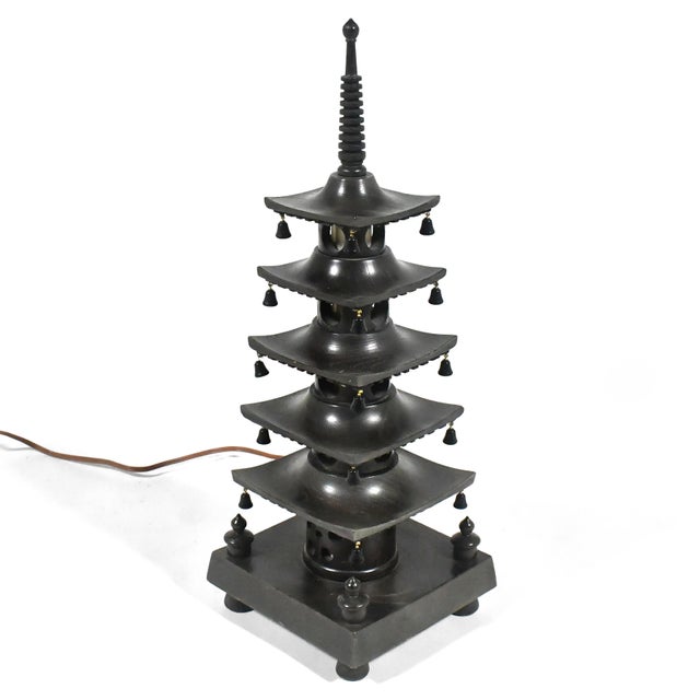 This lovely little lamp in the form of a Japanese pagoda adds a charming touch to any room. An internal light glows from...