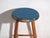 This antique wooden stool is a three-legged seat with a round seat and turned splayed legs joined by stretchers. It...