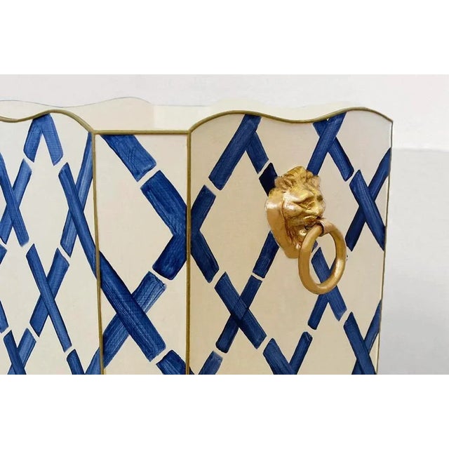 New special order item. Not vintage. Cream and navy blue square wastebasket with raised ends and gold leaf lion head...