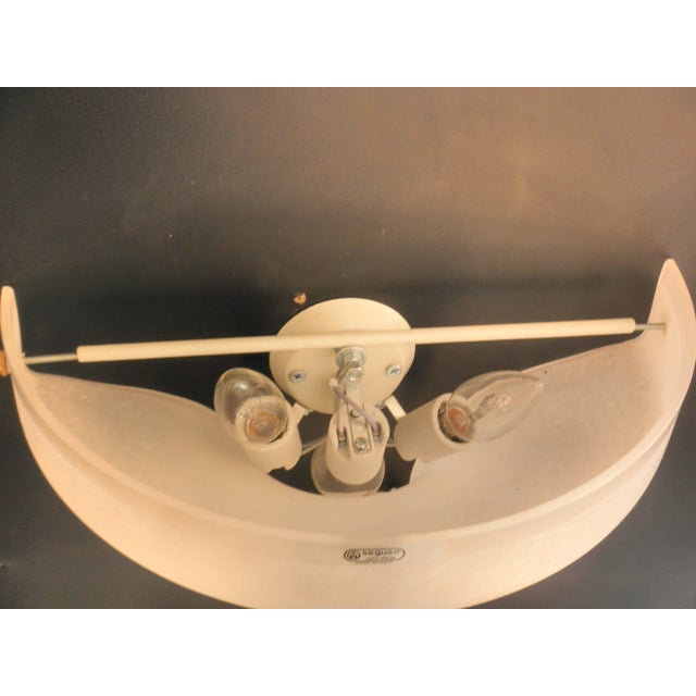 This pair of white frosted wall lights was designed by Giovanni Patrini and produced by Seguso in the 1980s. Labeled by...