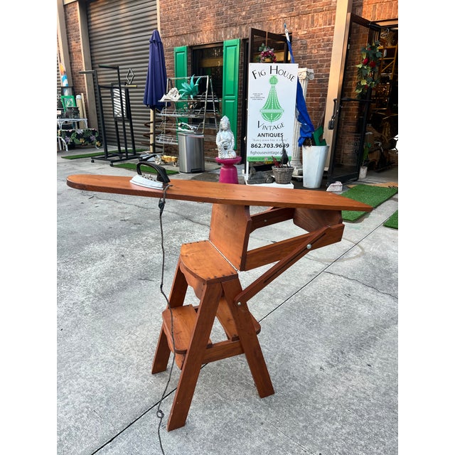 Up for consideration is a beautiful vintage wooden ironing board with a ladder and chair conversion. This would look...