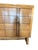 A vintage mid-century chest of drawers with a faux buckle front and eight drawers and with a stretcher base. The drawers...
