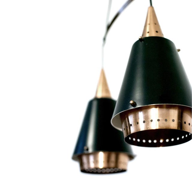 Norwegian classic pendant lamp, from the mid-century. Copper and black matte lampshade. Adjustable brass support. Perfect...