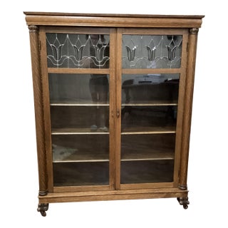 Arts & Craft Antique Oak Bookcase Double Doors Lead-Glass Tulips Claw Feet on Rollers For Sale