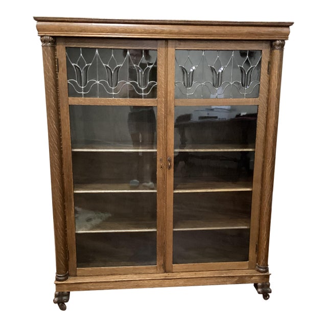 Arts & Craft Antique Oak Bookcase Double Doors Lead-Glass Tulips Claw Feet on Rollers For Sale