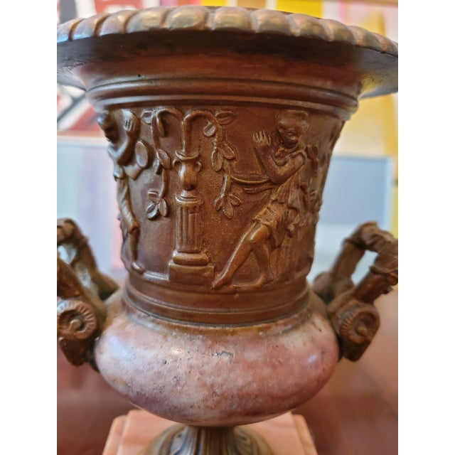 Antique original Rouge Royall marble and patinated bronze grand tour urn. Having detailed cast bronze panels depicting...