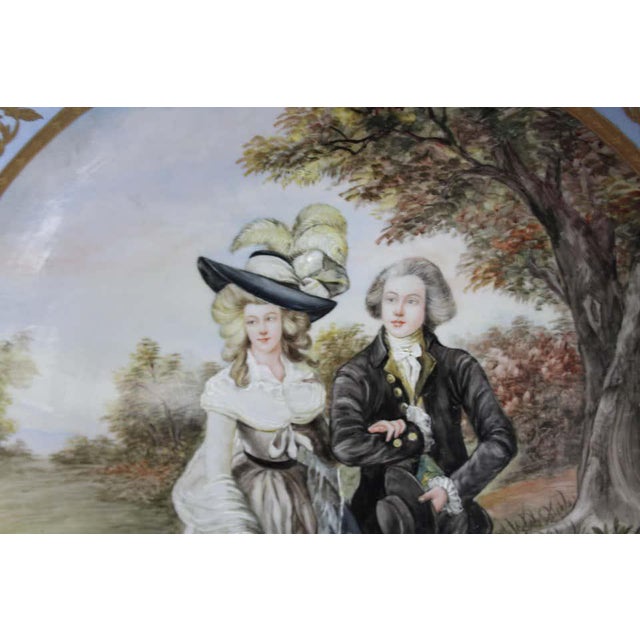 A fine Vienna wall plaque, early 20th century. Fine painted with a lady and a gallant with a white dog to her side. All...