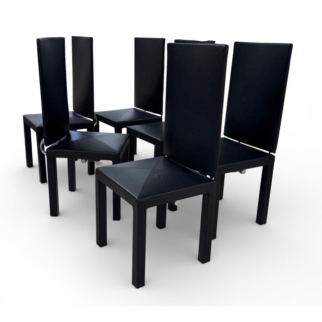 Set of 6 B&B Italia Arcadia High-Back Dining Chairs, designed in the 1980s by Paolo Piva. Upholstered in black leather...
