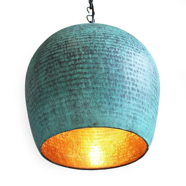 Hand pounded copper lantern with beautiful verdigris patina on the exterior with true copper finish on the interior. The...