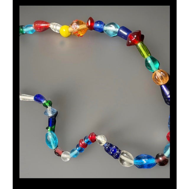 Tribal Bohemian Glass From Jablonec Nad Nisou (Formerly Gablonz) Pressed Glass Bead Necklace in Various Colors and Shapes For Sale - Image 3 of 6