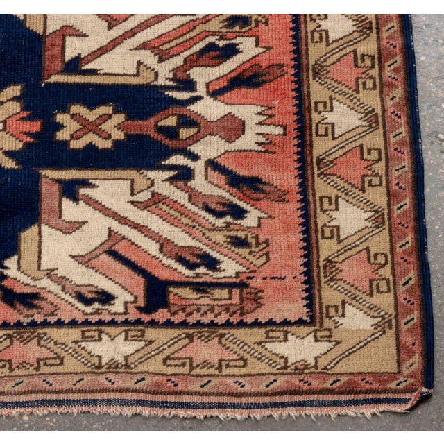 Caucasian Eagle Kazak Wool Rug, with central geometric and arrow design on red ground, dated 1980. to reverse. 6' 6" L x...