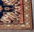 Caucasian Eagle Kazak Wool Rug, with central geometric and arrow design on red ground, dated 1980. to reverse. 6' 6" L x...
