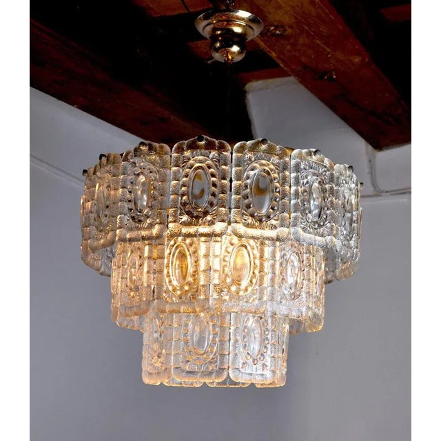 Superb Kinkeldey chandelier designed and produced in Germany in the 70s. Golden structure composed of more than 20...