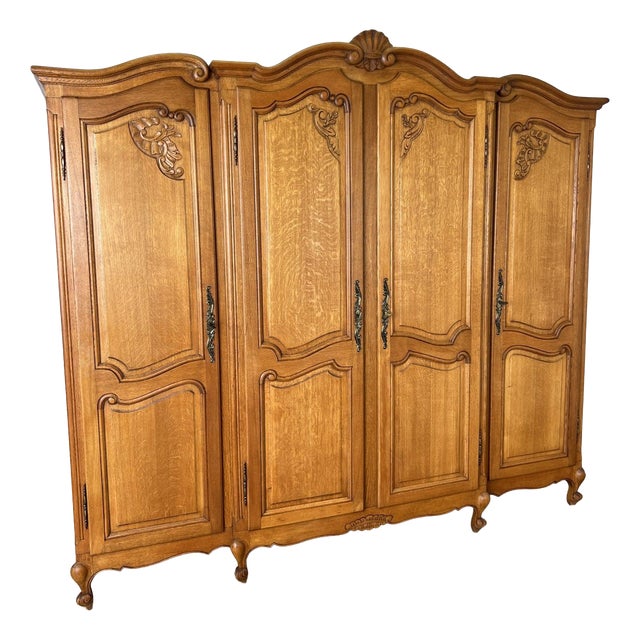 Vintage Louis XVI French Oak Four Door Carved Armoire For Sale