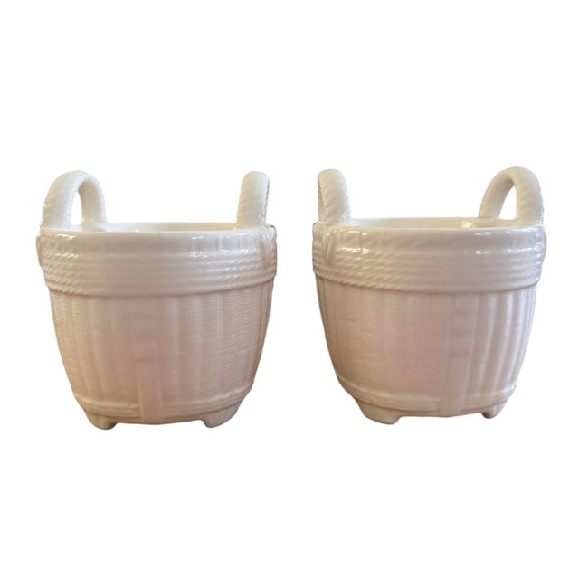 Pair of fine bone porcelain cachepot by Tiffany. In the shape of Nantucket style baskets. Great potted with orchids,...