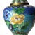 An antique Chinese cloisonné enameled vase, dating to approximately C1920. The piece features a design of two birds...