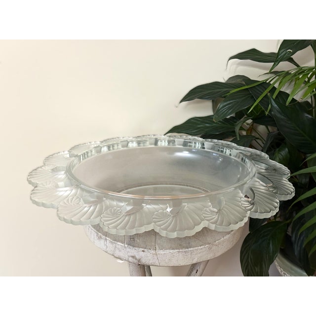 This large Art Deco centerpiece bowl was produced by Verlys France in 1935 and features an elegant fern leaf border molded...