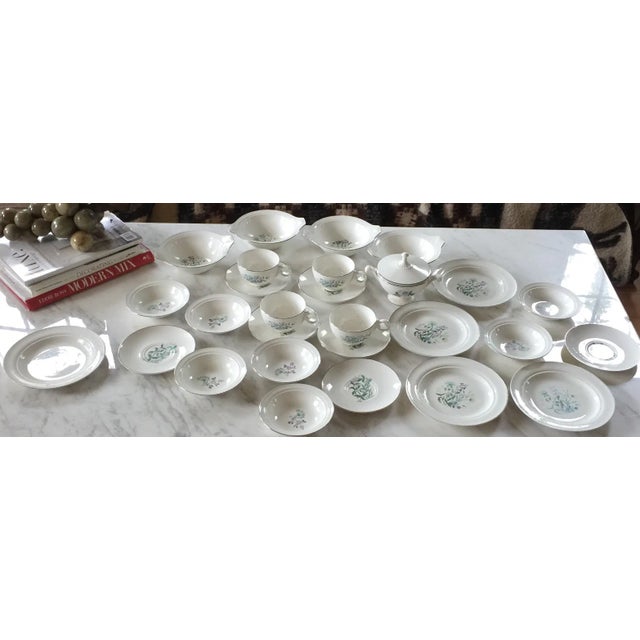 A great garden-themed silver rimmed vintage tea set with plates. The whole set has 28 pieces included with 4 teacups, 4...