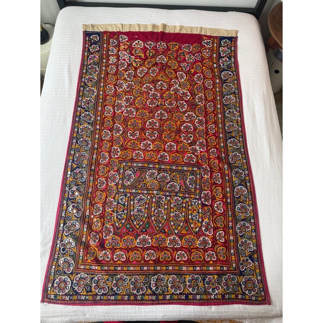 An extraordinary piece of textile art, this antique Indian Gujarati ceremonial door hanging (Toran) dates back to the...