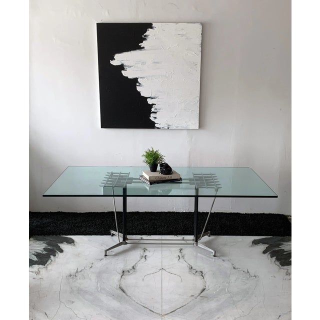 This dining table is equal parts post modern and industrial modern and just oozes California modernism. This dining table...