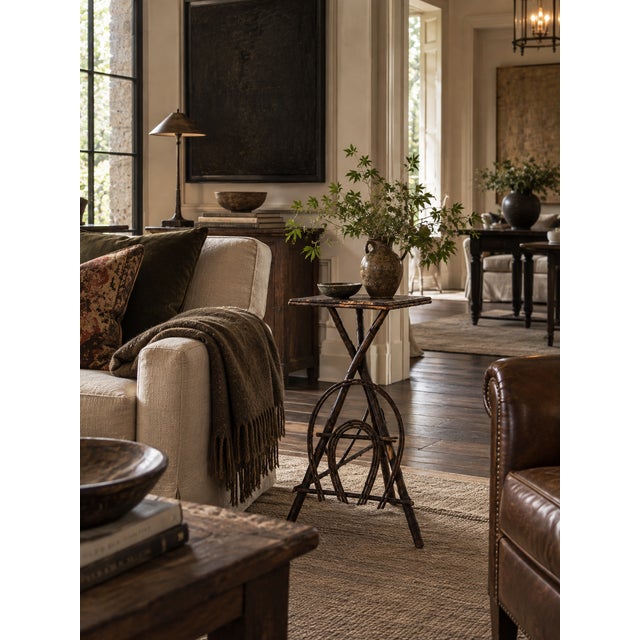 This is an antique Adirondack twig table. Crafted from willow branches, the rustic black table features a bentwood...